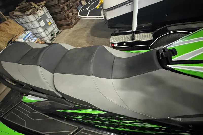 Slide: The Image of 2021 Yamaha WaveRunner FX SHO with green design in a garage. - 4