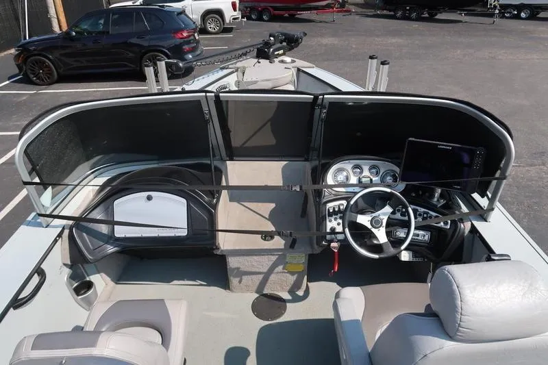 Slide: The Image of 2008 Starcraft STX PRO 2050 boat interior with steering wheel and dashboard controls. - 14