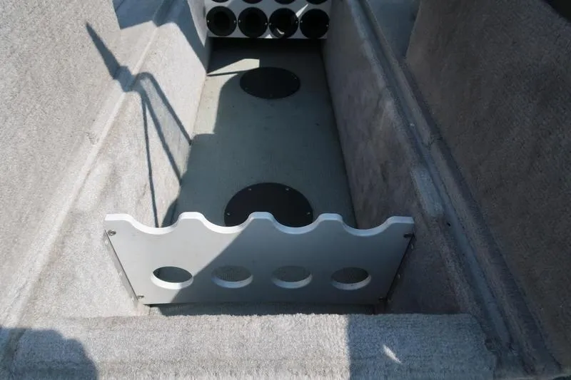 Slide: The Image of 2008 Starcraft STX PRO 2050 boat interior with rod holders and carpeted flooring. - 21