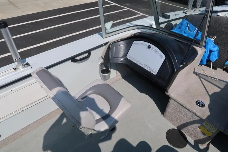 Slide: The Image of 2008 Starcraft STX PRO 2050 boat interior with seating and storage compartment. - 26