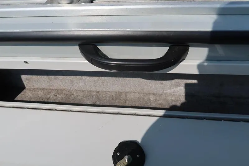 Slide: The Image of 2008 Starcraft STX PRO 2050 boat storage compartment with handle and latch. - 30