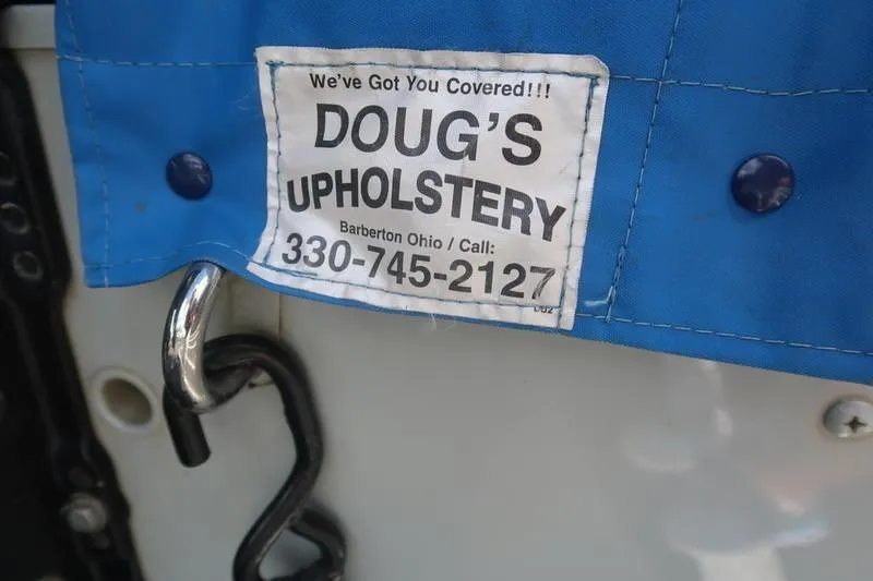Slide: The Image of Blue upholstery cover with Doug's Upholstery contact label, Starcraft STX PRO 2050, 2008. - 39
