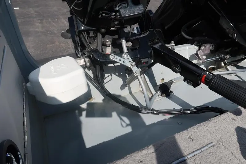 Slide: The Image of 2008 Starcraft STX PRO 2050 boat engine and control cables close-up. - 40