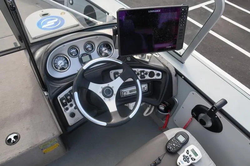 Slide: The Image of 2008 Starcraft STX PRO 2050 boat dashboard with steering wheel and navigation equipment. - 54