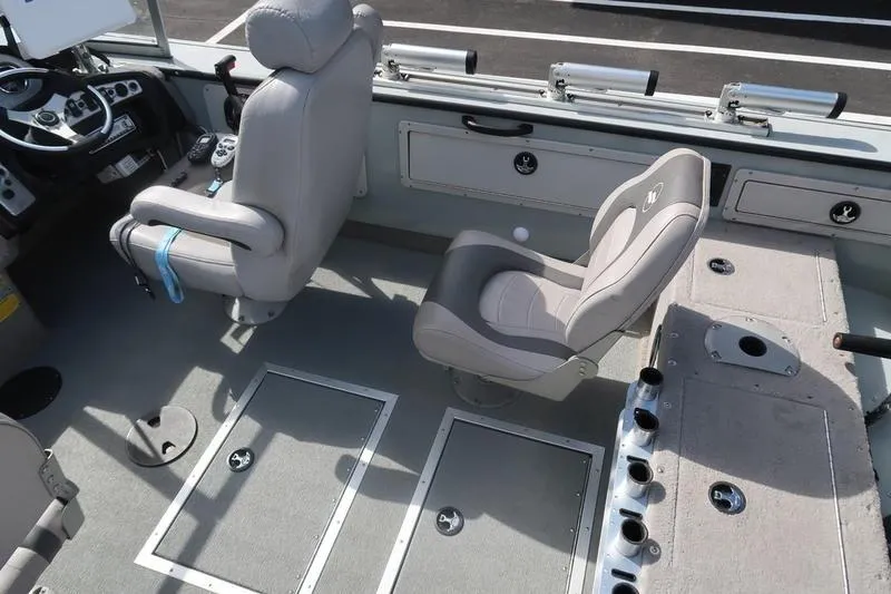 Slide: The Image of 2008 Starcraft STX PRO 2050 boat interior with seating and control panel. - 57