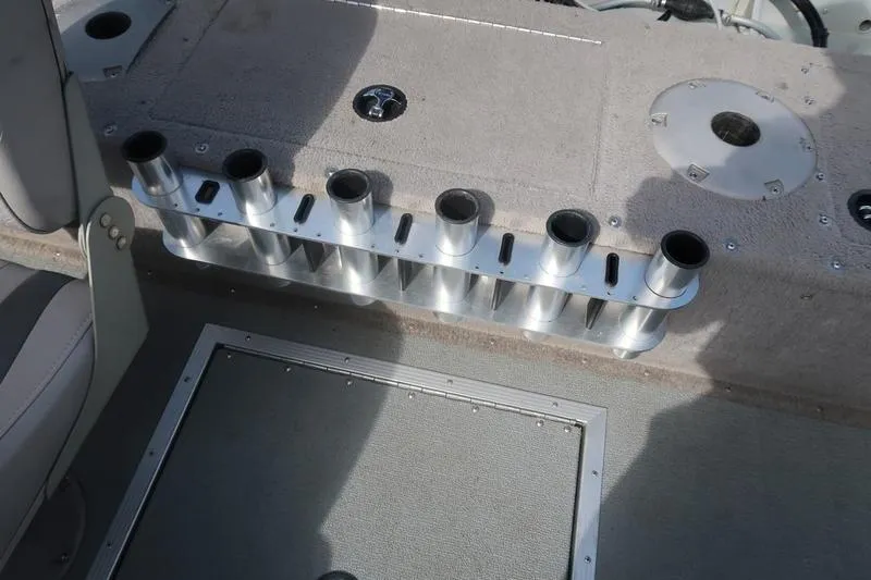 Slide: The Image of 2008 Starcraft STX PRO 2050 boat interior with rod holders and carpeted deck. - 60