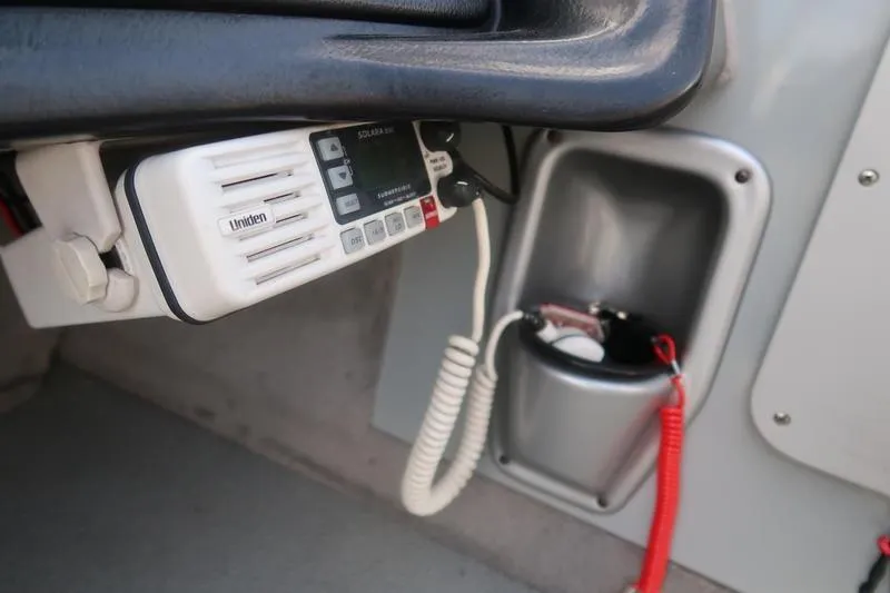 Slide: The Image of 2008 Starcraft STX PRO 2050 boat interior with Uniden radio and safety equipment. - 62