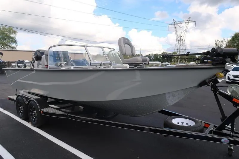 Slide: The Image of 2008 Starcraft STX PRO 2050 boat on trailer, parked outdoors under cloudy sky. - 7