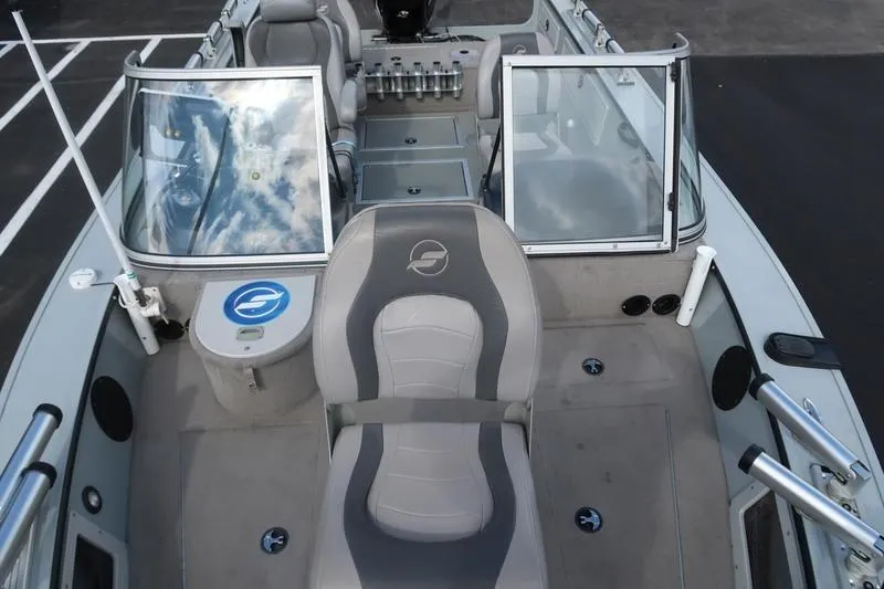 Slide: The Image of 2008 Starcraft STX PRO 2050 boat interior with seating and windshield, showcasing spacious design. - 71