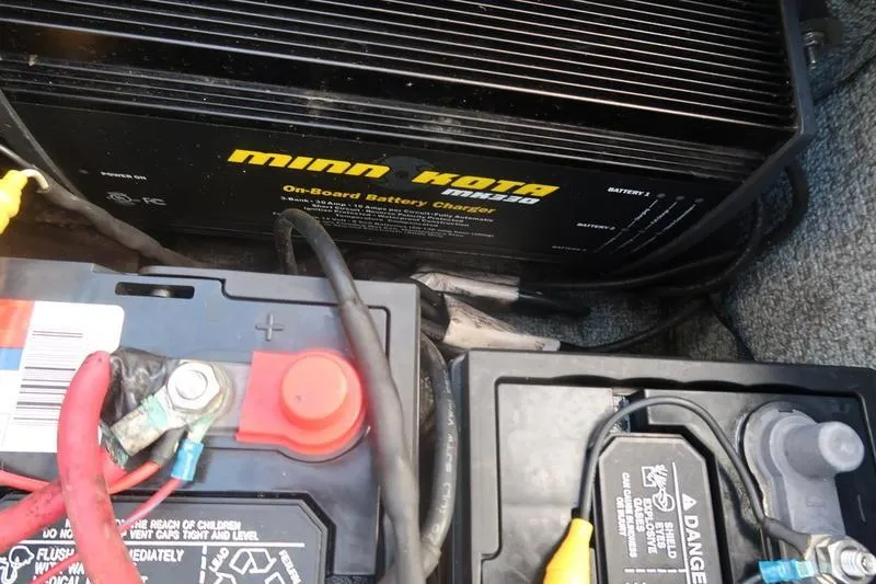 Slide: The Image of 2008 Starcraft STX PRO 2050 with Minn Kota onboard battery charger and connected batteries. - 73