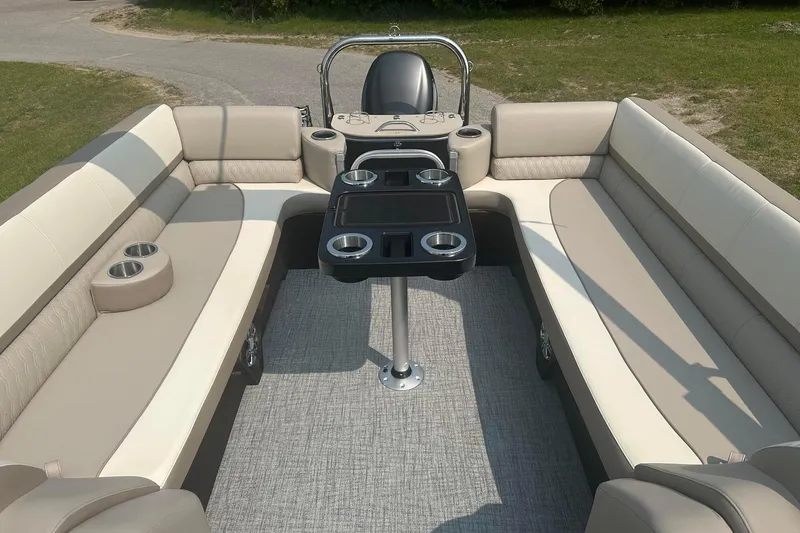 Slide: The Image of Luxurious 2025 Tahoe 2585 boat interior with plush seating and cup holders. - 12