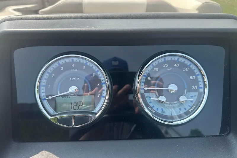 Slide: The Image of Dashboard of 2025 Tahoe 2585 showing RPM, speed, and voltage gauges. - 19