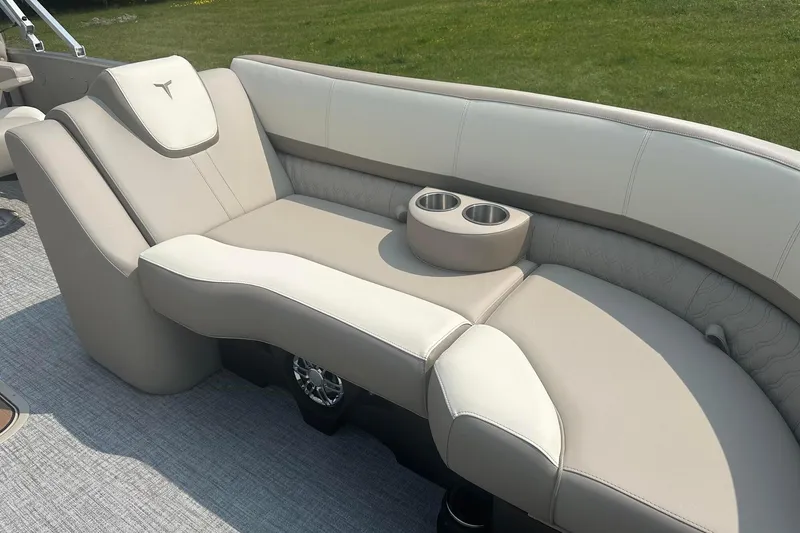 Slide: The Image of Luxurious seating on 2025 Tahoe 2585 boat with cup holders, beige upholstery. - 24