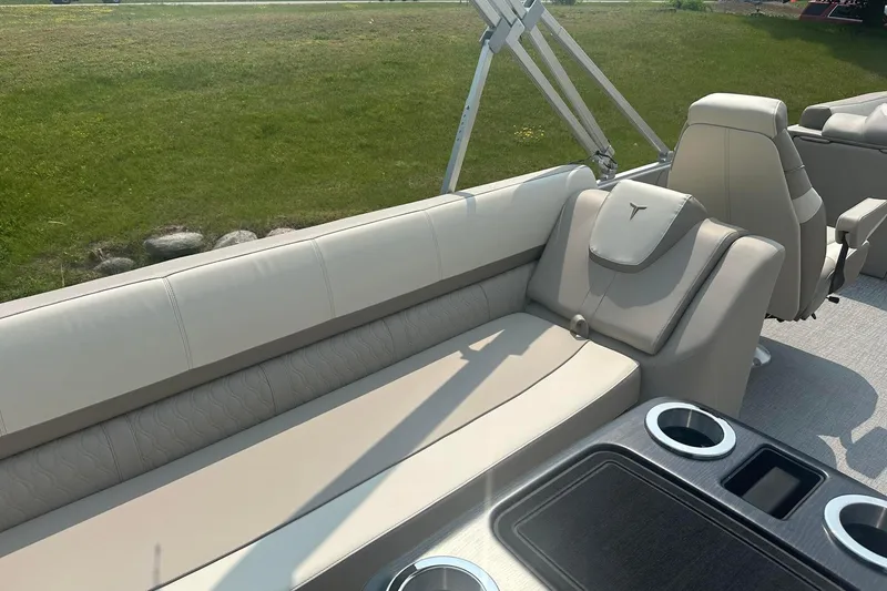 Slide: The Image of Luxurious seating on 2025 Tahoe 2585 boat with cup holders and modern design. - 9