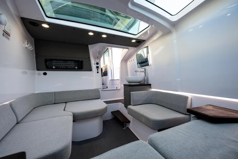 Slide: The Image of Luxurious interior of 2022 Axopar 37 XC boat with modern seating and skylight. - 11