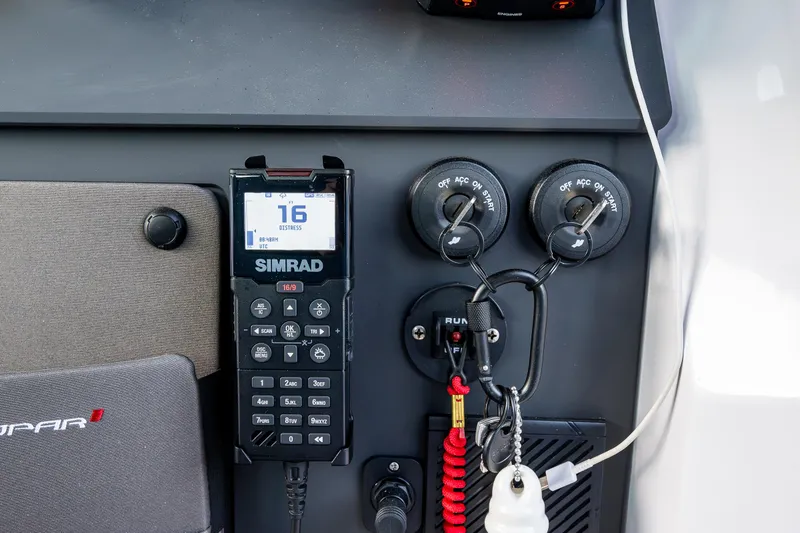 Slide: The Image of Control panel of 2022 Axopar 37 XC boat with Simrad radio and switches. - 21