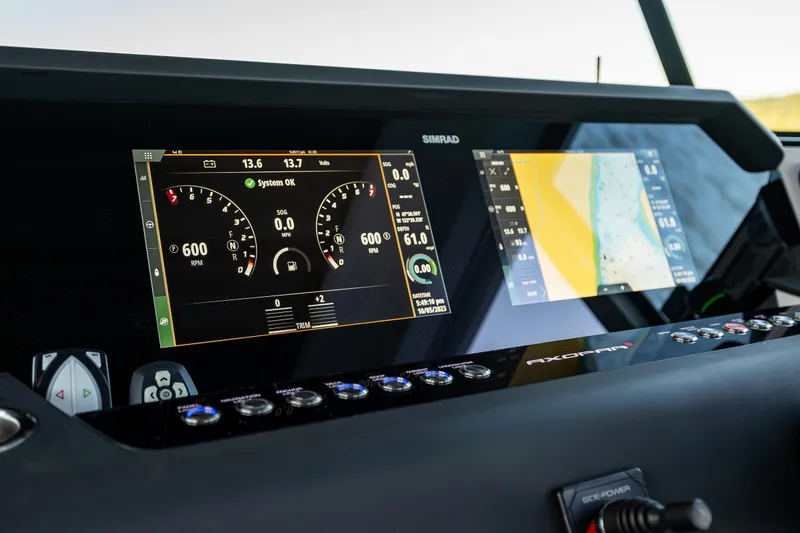 Slide: The Image of Dashboard of 2022 Axopar 37 XC with Simrad navigation displays. - 24