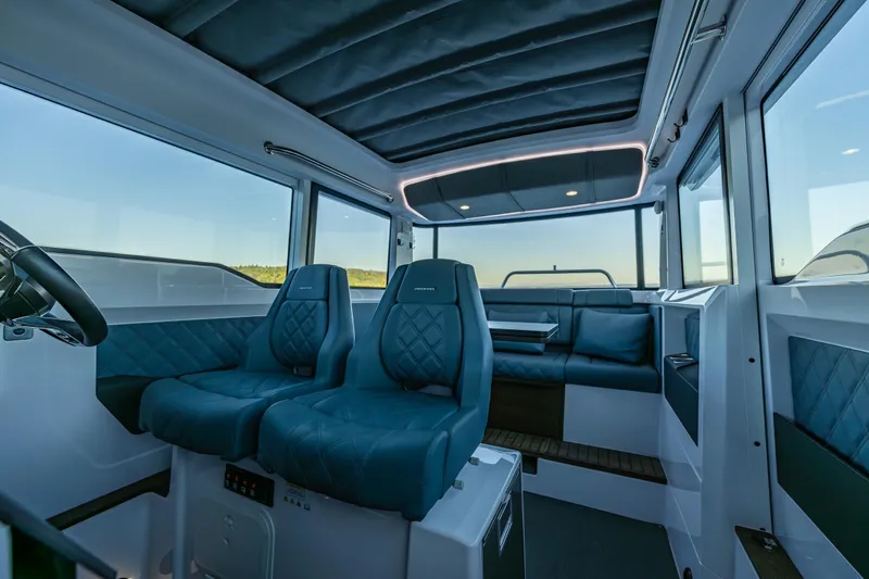 Slide: The Image of Luxurious interior of 2022 Axopar 37 XC boat with plush seating and modern design. - 27