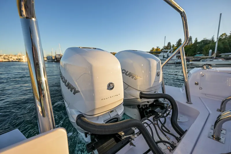 Slide: The Image of 2022 Axopar 37 XC with dual Mercury outboard engines on a sunny day. - 7