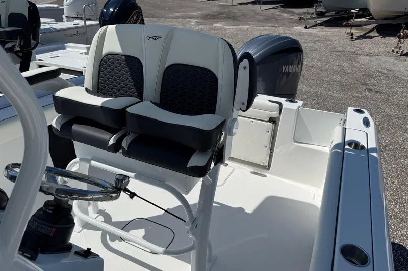 Slide: The Image of 2026 Tidewater 232 CC Adventure boat interior with dual seats and Yamaha engine. - 15