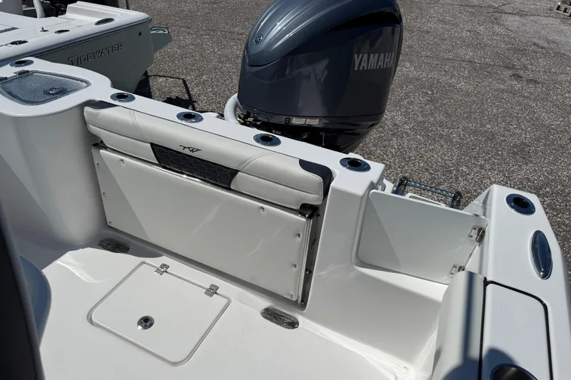 Slide: The Image of 2026 Tidewater 232 CC Adventure boat with Yamaha engine, featuring sleek seating and storage. - 16