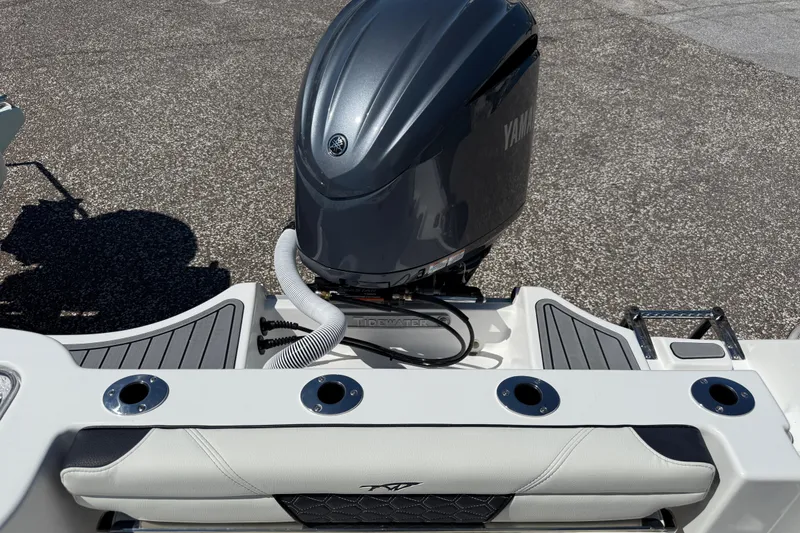 Slide: The Image of 2026 Tidewater 232 CC Adventure boat with Yamaha outboard motor, rear view. - 18