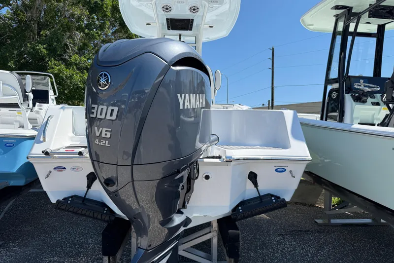 Slide: The Image of 2026 Tidewater 232 CC Adventure boat with Yamaha 300 V6 engine displayed outdoors. - 5