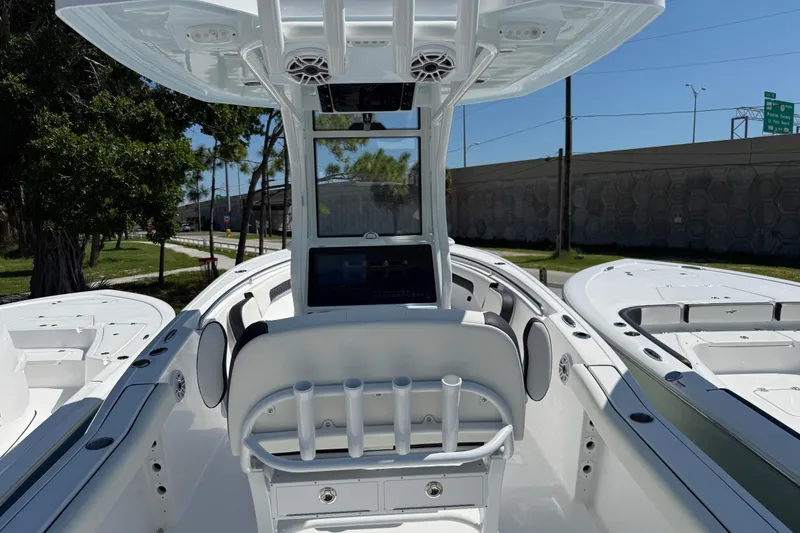 Slide: The Image of 2026 Tidewater 232 CC Adventure boat interior with modern console and seating. - 6