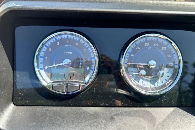 Slide: The Image of Dashboard gauges of a 2025 Tahoe 2585, displaying RPM and speed in MPH. - 13