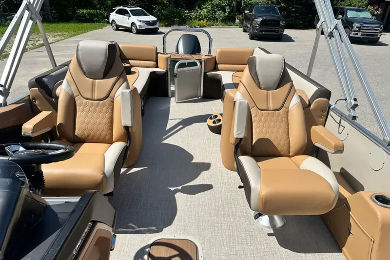 Slide: The Image of 2025 Tahoe 2585 boat interior with luxurious tan seating and modern design. - 15