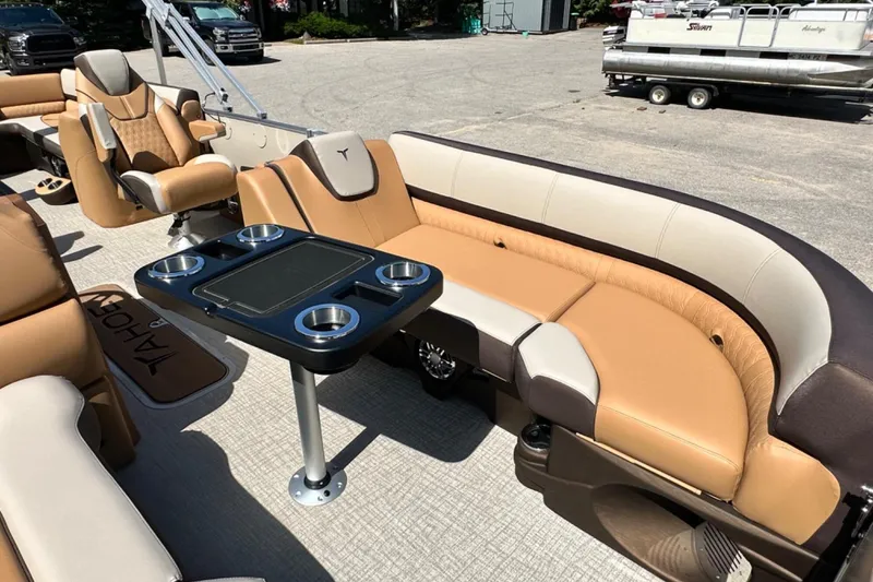 Slide: The Image of Luxurious seating on 2025 Tahoe 2585 boat with cup holders and table. - 20
