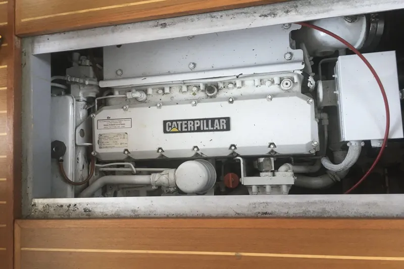 Slide: The Image of 1999 Mainship 350 Trawler engine compartment featuring a Caterpillar engine. - 25