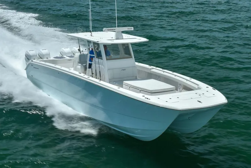 Slide: The Image of 2026 Invincible 40 Catamaran cruising on open water, showcasing sleek design and powerful performance. - 1