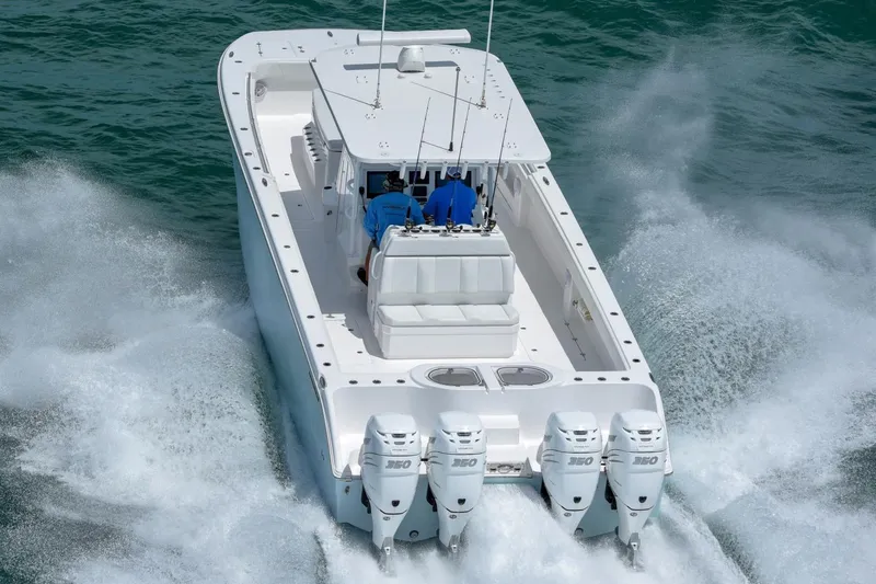 Slide: The Image of 2026 Invincible 40 Catamaran with four engines cruising on open water. - 5