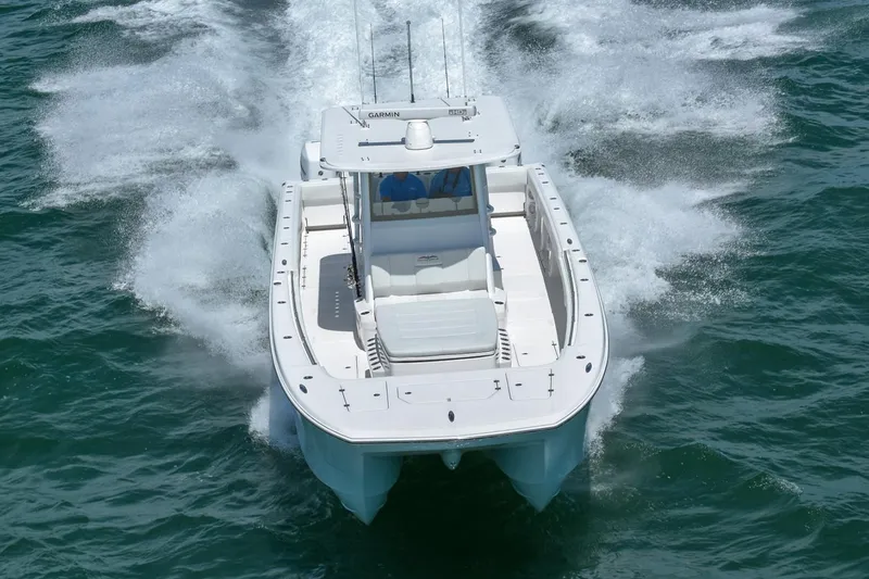 Slide: The Image of 2026 Invincible 40 Catamaran cruising on open water, showcasing sleek design and powerful performance. - 4