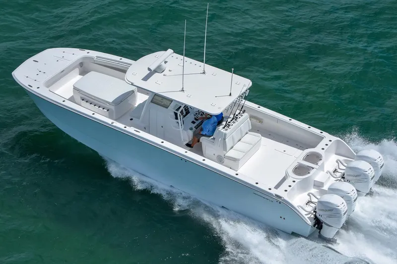 Slide: The Image of 2026 Invincible 40 Catamaran cruising on open water, showcasing sleek design and powerful engines. - 3
