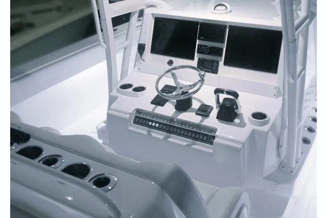 Slide: The Image of Cockpit of 2026 Invincible 40 Catamaran with modern navigation equipment and controls. - 7