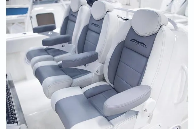 Slide: The Image of Luxury seating on 2026 Invincible 40 Catamaran, featuring sleek gray and white design. - 8