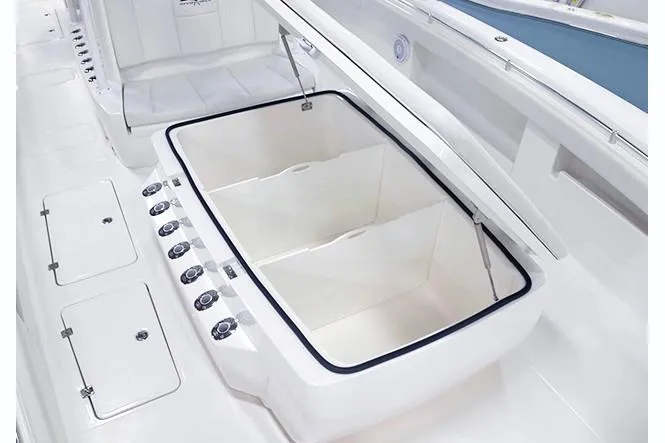 Slide: The Image of Open storage compartment on 2026 Invincible 40 Catamaran boat, showcasing spacious interior design. - 6