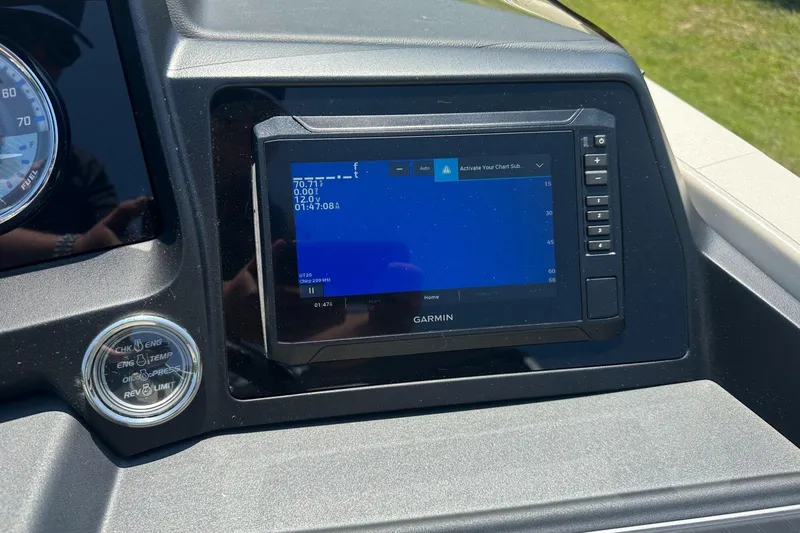 Slide: The Image of Dashboard of a 2025 Tahoe 2585 with Garmin navigation display. - 16
