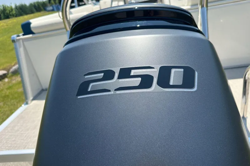 Slide: The Image of Close-up of 2025 Tahoe 2585 boat engine with '250' label in sunlight. - 6
