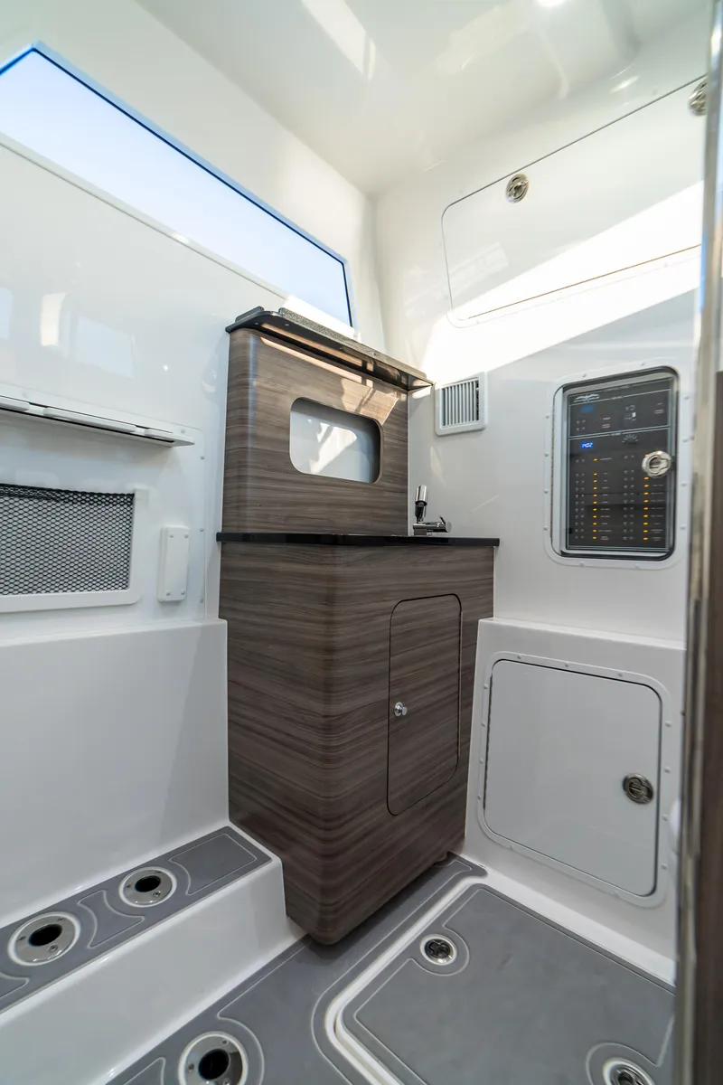 Slide: The Image of 2025 Invincible 43 Open Fisherman interior cabin with modern amenities. - 12