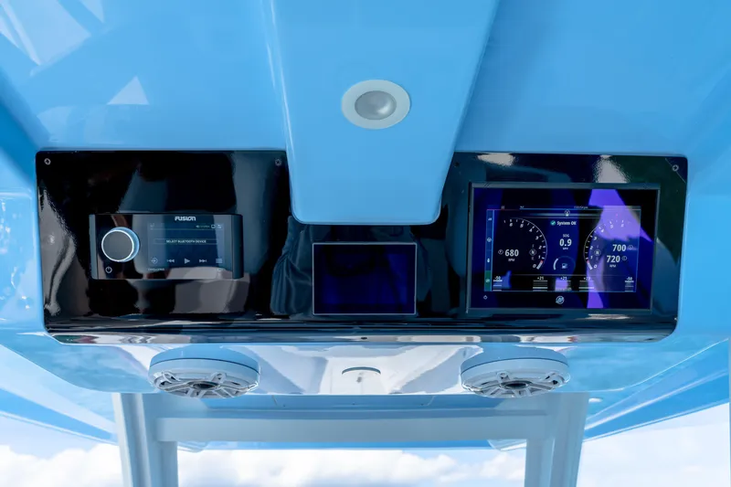 Slide: The Image of 2025 Invincible 43 Open Fisherman dashboard with advanced navigation and control systems. - 14