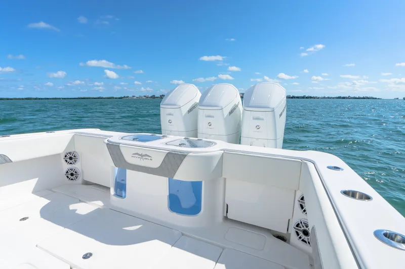 Slide: The Image of 2025 Invincible 43 Open Fisherman boat with triple outboard engines on the water. - 19