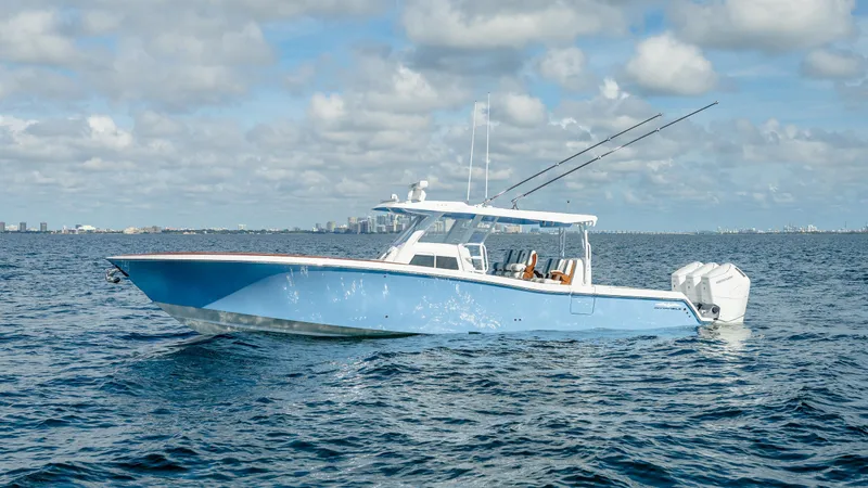 Slide: The Image of 2025 Invincible 43 Open Fisherman boat on open water under a cloudy sky. - 2