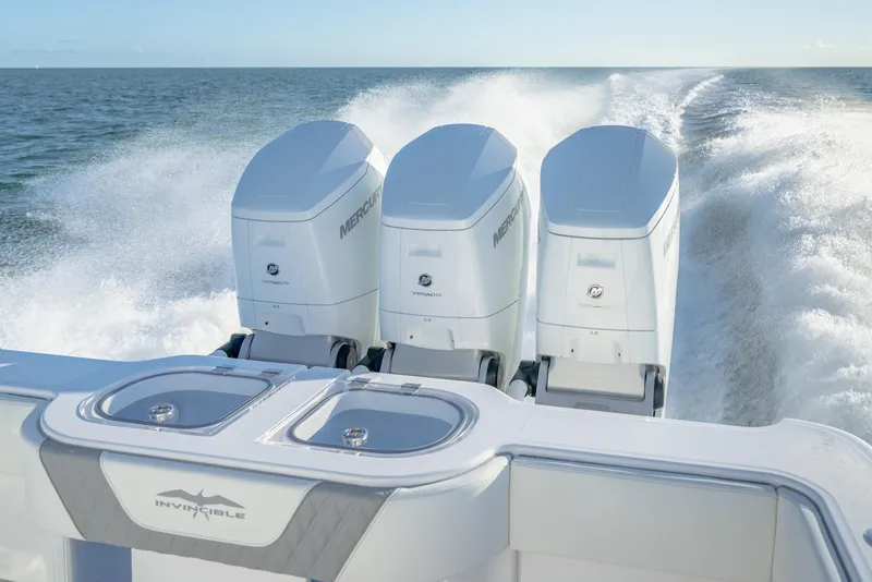 Slide: The Image of 2025 Invincible 43 Open Fisherman with triple Mercury outboard engines on the water. - 20