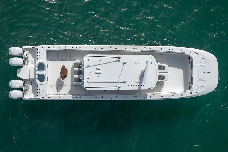 Slide: The Image of Aerial view of 2026 Invincible 46 Catamaran on turquoise water. - 4