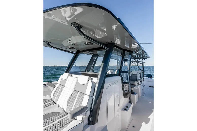 Slide: The Image of 2026 Invincible 46 Catamaran with sleek design and modern seating on open water. - 6