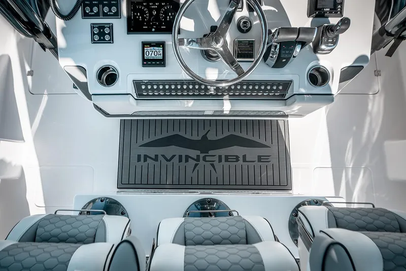 Slide: The Image of Cockpit of 2026 Invincible 46 Catamaran with modern controls and seating. - 9
