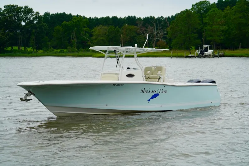 Slide: The Image of 2015 Southport 29 FE boat on calm water, labeled "She's so Fine." - 14